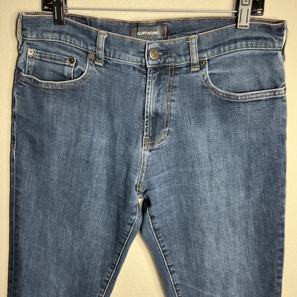 Bluffworks Departure Jeans Mens 34x32 Slim Fit Indigo Blue Travel Stretch Denim